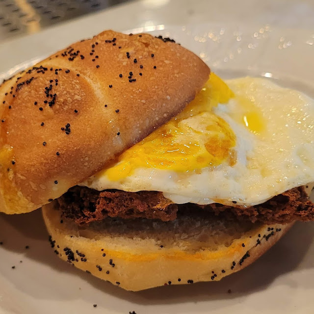 Sesame Roll with Scrapple Fried Egg and Cheddar