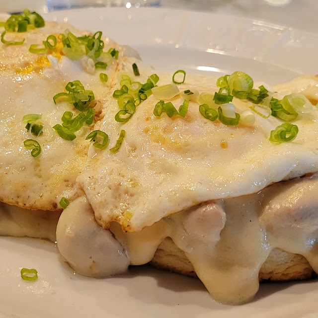 Biscuits and Sausage Gravy Add Two over Easy Eggs