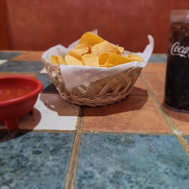 Salsa and Chips Waiting on My Cheese Burrito