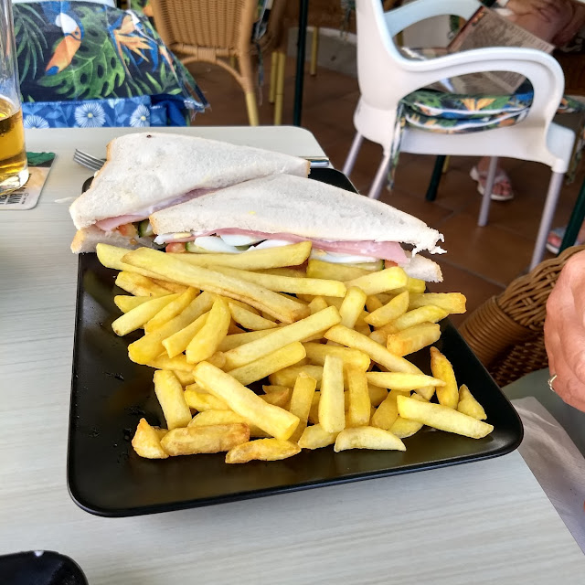 A Cold Sandwich Egg Cheese and Ham Salad with Chips