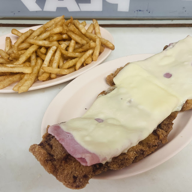 Breaded Steak Topped with Ham and Cheese