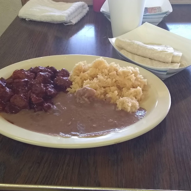 Pork with Red Salsa Sides of Rice and Beans