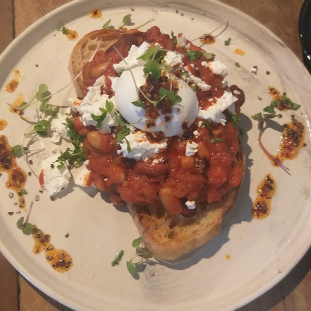 Poached Eggs on Sourdough with Baked Beans and Feta Cheese