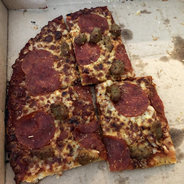 Thin Crust Pizza with Peperoni and Sausage
