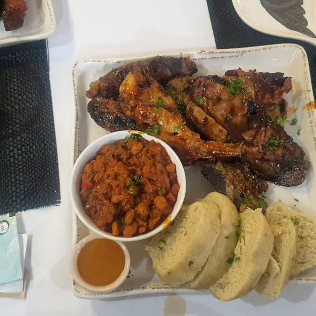 Platter with Pork Ribs Chicken Wings Steamed Bread and Chakalaka