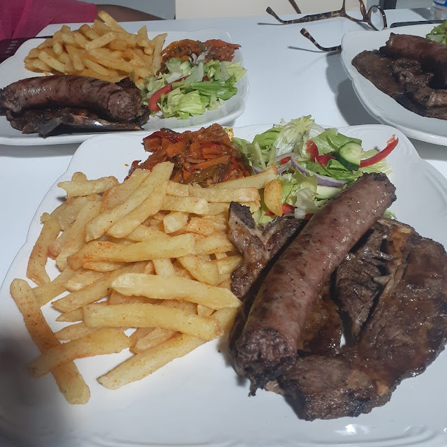 Combo 1 Steak and Wors Served with Chips and Two Salads