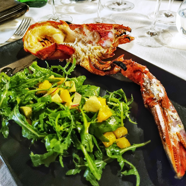 Grilled Fresh Lobster with a Salad of Avocado Arugula Radish and Mango