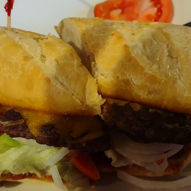 Snowplow Steak Burger Cheddar Cheese Jalapeño Peppers Lettuce Tomato Spicy Taco Sauce & Raw Onion