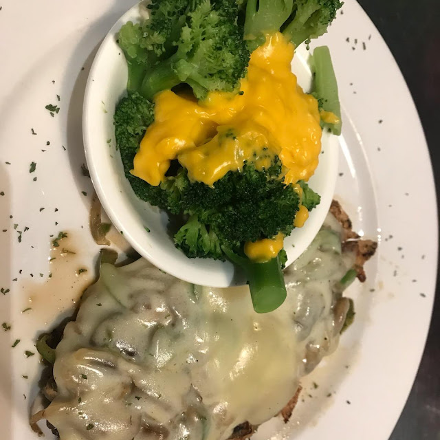 Smothered Chicken with Peppers Onions and Provolone Cheese and Broccoli and Cheese