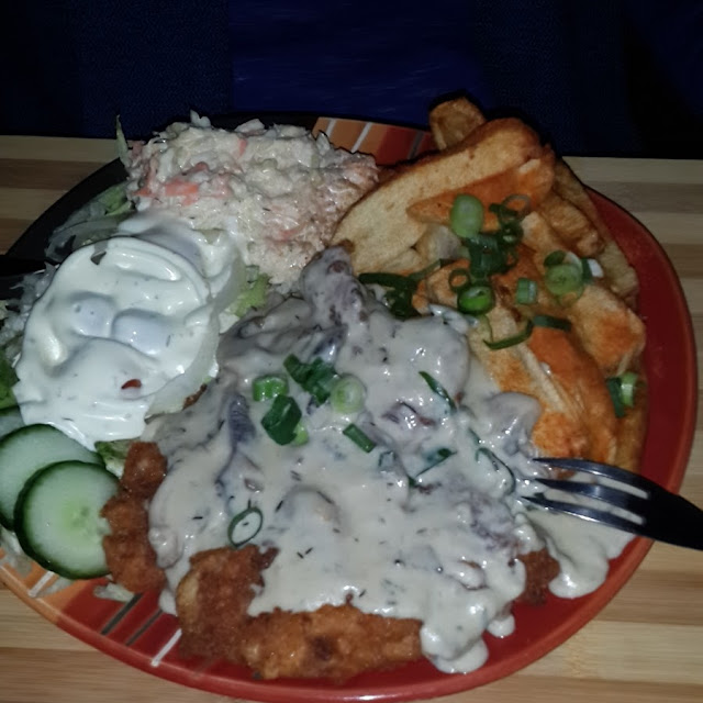 Pork Schnitzel with Wedges and Salad with Mushroom Sause