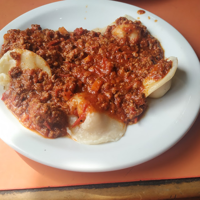 Ravioles Con Bolognesa