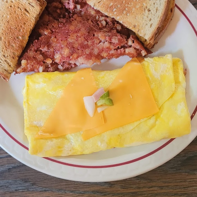 Crispy Hash and a Western Omelette with Crispy Corned Beef Hash Cooked to Perfection