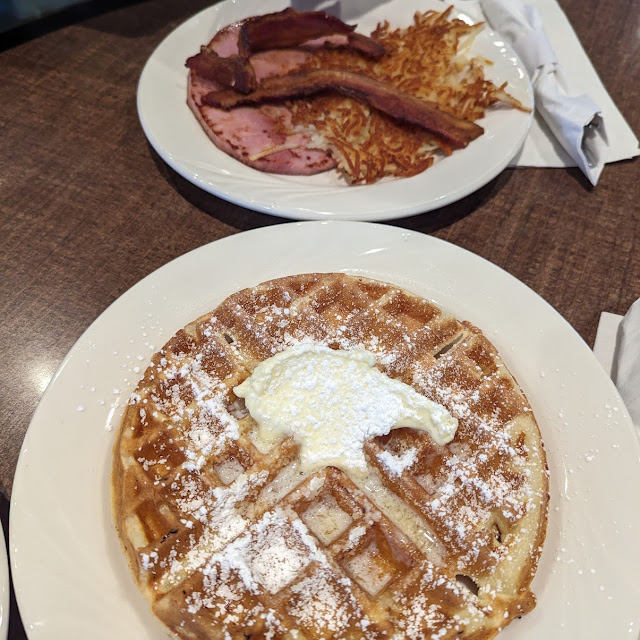 Plate of Waffles and Ham Bacon Hash Browns Plate