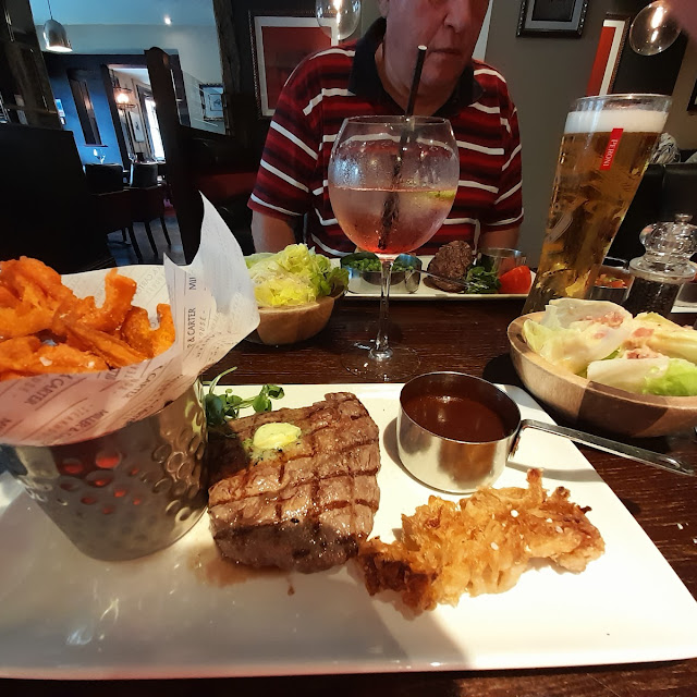 Black Angus Ribeye 8oz Steak with Sweet Potato Fries Beef Dripping Sauce Onion Loaf Lettuce