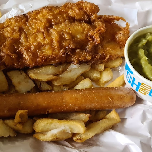 Fish Chips Sausage and Mushy Peas