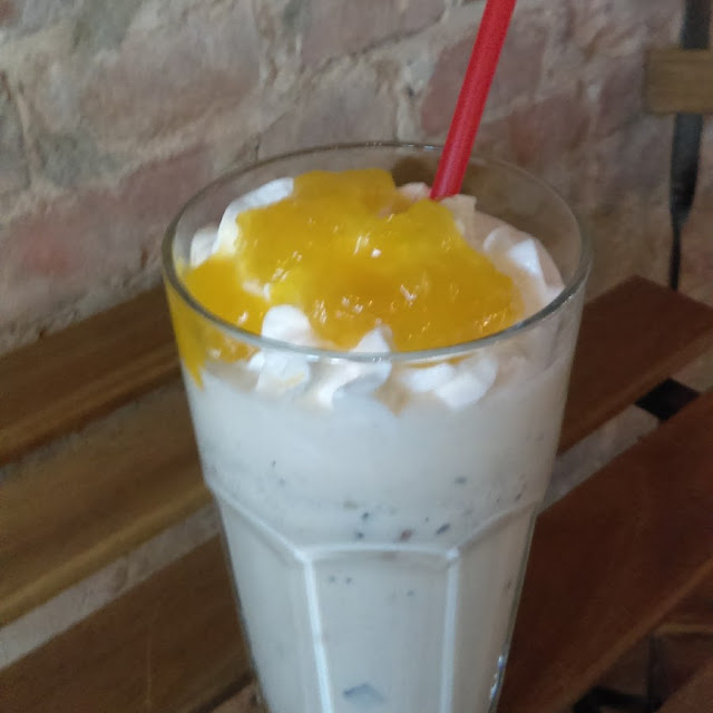 Pina Colada Shake Cocoanut Ice Cream Blended with Pineapple Sherbet Topped with Crushed Pineapple