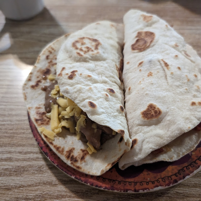Carne Guisada Taco w Cheese and a Potato Bacon Egg and Cheese Taco