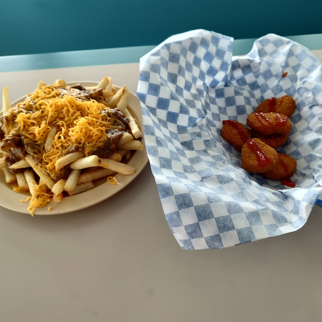 Chili Cheese Fries Chicken Nuggets Topped with Ketchup